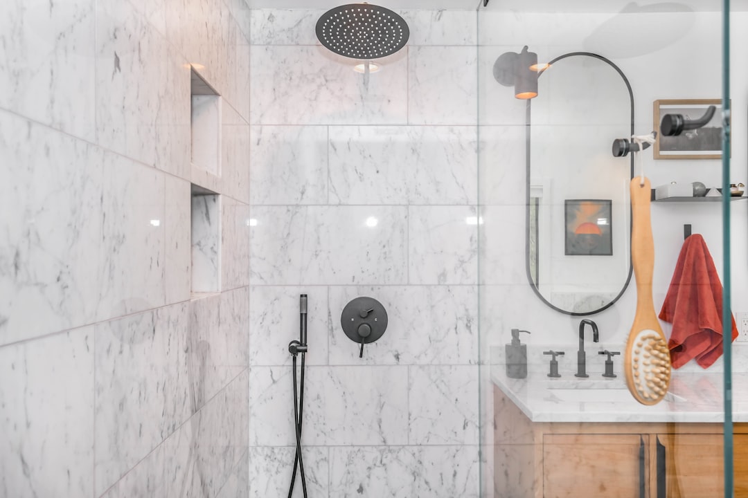 A Lakewood bathroom before and after a tub-to-shower remodel
